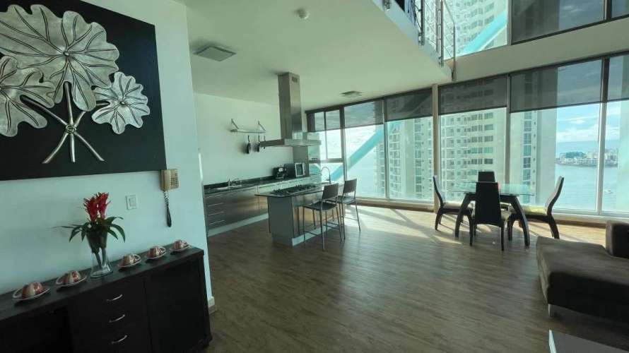 Modern kitchen with granite island, stainless appliances, ocean and city views PH Ocean Club Punta Pacifica Panama