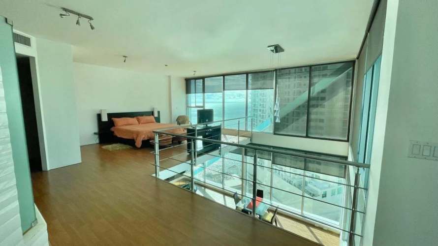 Infinity swimming pool overlooking the Pacific Ocean with skyline background at PH Ocean Club Punta Pacifica Panama