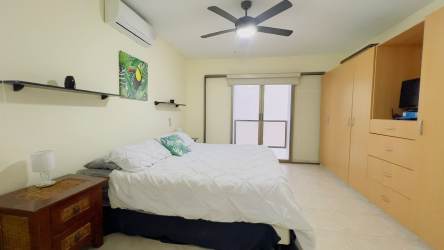 Contemporary bathroom with glass shower granite countertop Playa Blanca Resort condo Panama