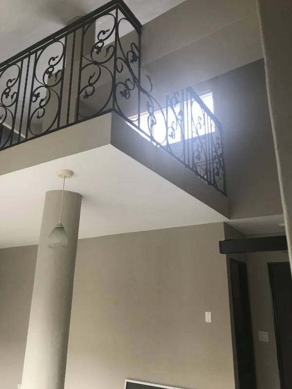 Interior loft space with decorative railing, pendant lighting, high ceiling Panama