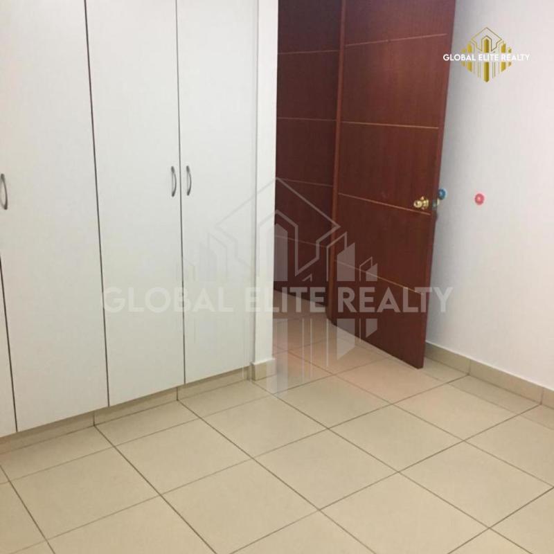 Bedroom featuring built-in wardrobes and tile flooring PH Pueblo Nuevo Panama