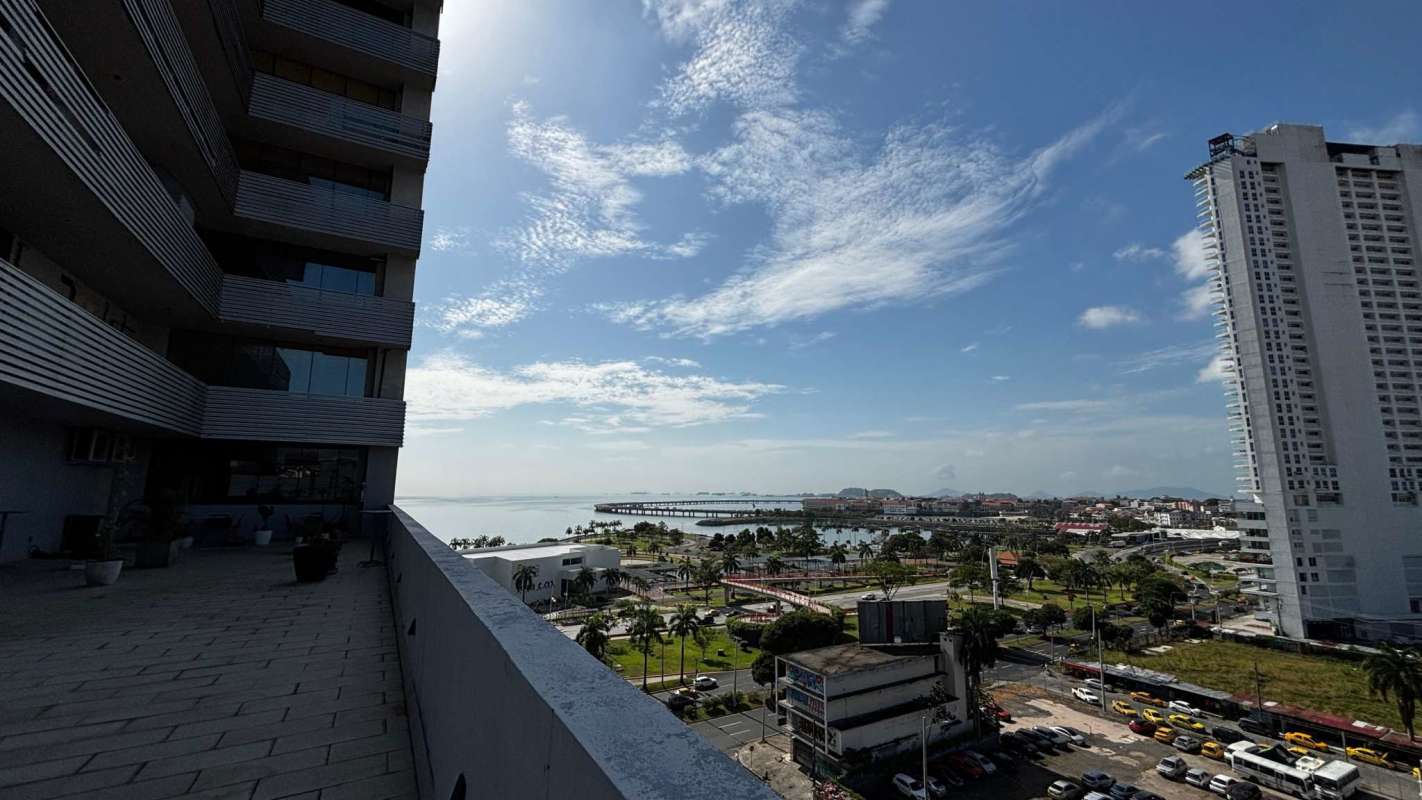 Modern corporate lobby reception of PH Balboa Office Center with signage and turnstiles on Avenida Balboa Panama