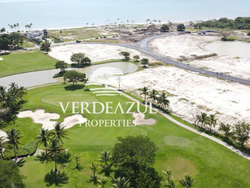 Aerial view of Nicklaus golf course by the Pacific Ocean at Buenaventura Resort Panama with beach and lots