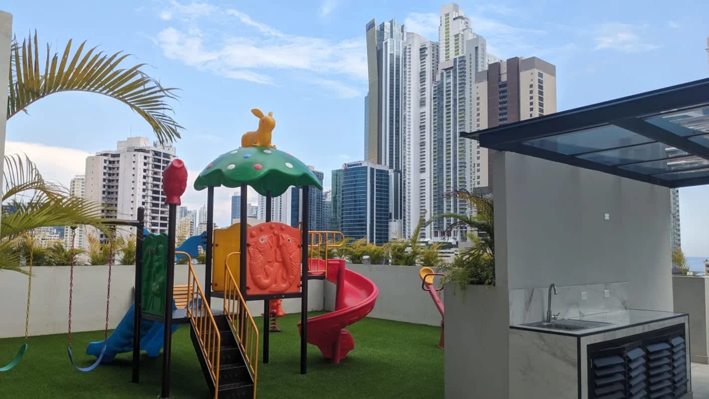 Rooftop lounge and terrace with palm trees at PH Costa Pacifica