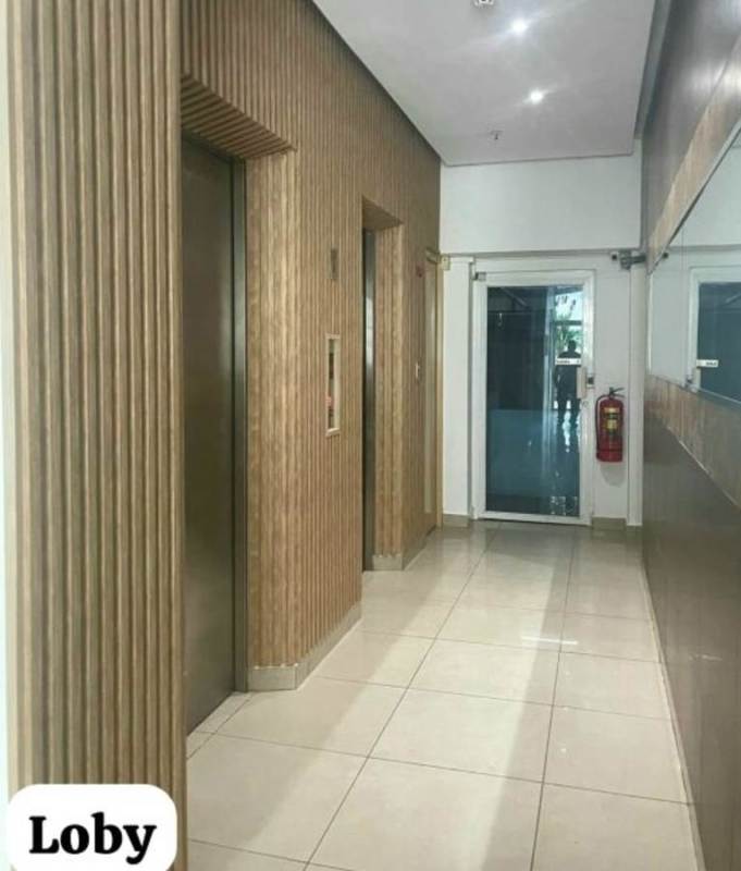 Lobby entrance with elevators and security in PH Crystal Blue Panama City