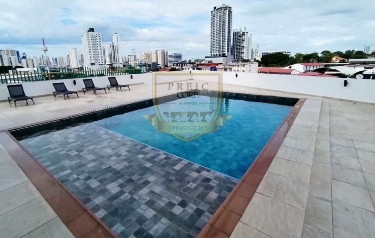 Rooftop swimming pool with lounge chairs panoramic views in PH Crystal Blue Panama City