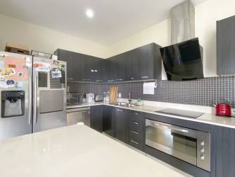 Child bedroom with blue accent wall built-in closet ceiling fan River Valley Panama Pacifico