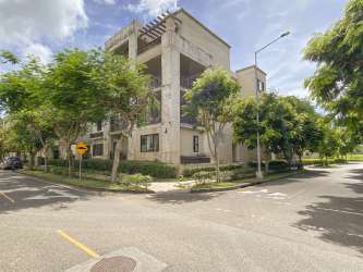 Modern Mediterranean apartment building corner lot with balconies River Valley Panama Pacifico