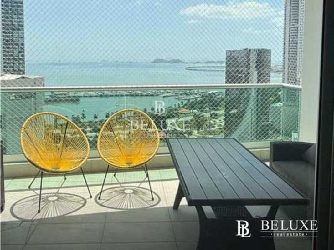 Furnished living room with ocean view balcony access PH Costanera luxury apartment Panama
