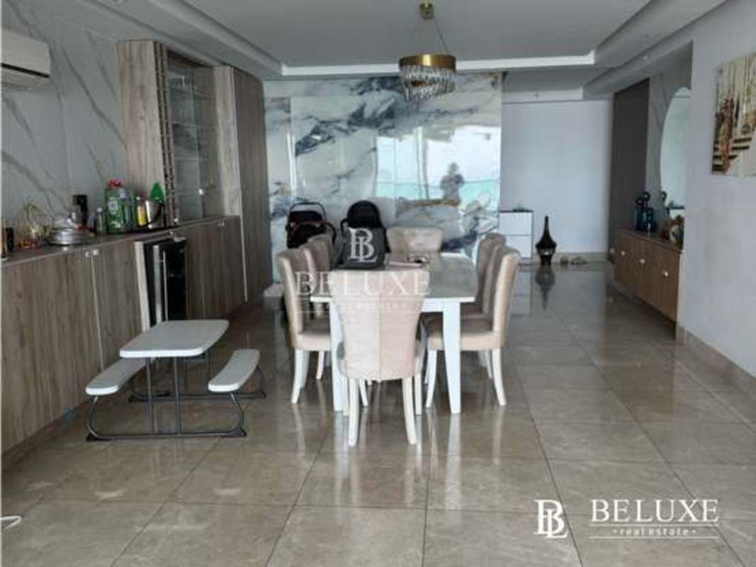Spacious dining area and open kitchen in luxury PH Costanera Avenida Balboa Panama