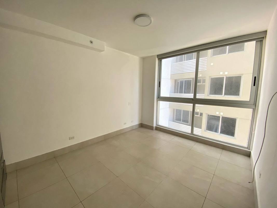 Modern living room with large balcony access and skyline views at PH Luxor 300 Panama City