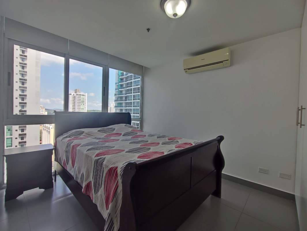 Modern bedroom with large windows and AC in PH Colores de Bella Vista Panama City