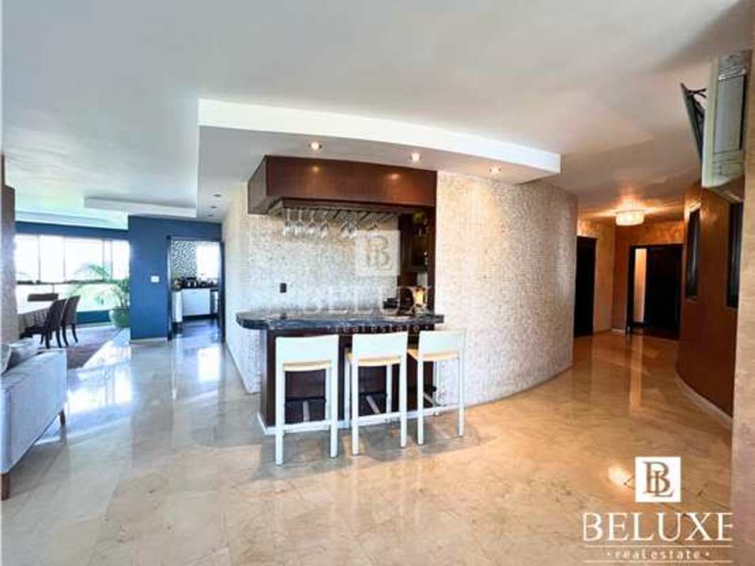 Spacious modern kitchen with center island, granite countertops, stainless appliances at PH Elite Panama