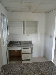 Functional kitchen with granite countertop in affordable house Panama Oeste