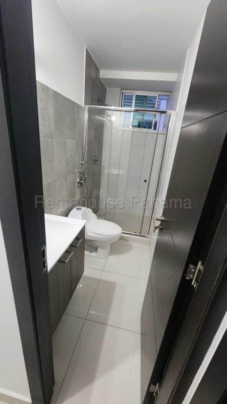 Narrow modern bathroom with glass enclosed shower in PH MIDPARK Carrasquilla Panama