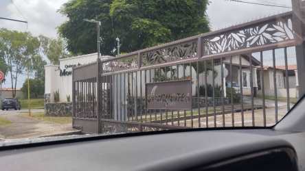 Minimalist spacious living room with tile flooring and large windows in house rental Chorrera Panama Oeste