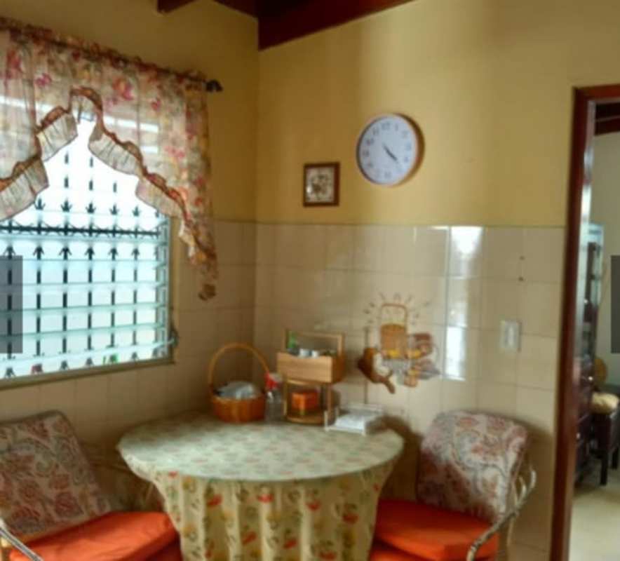 Traditional kitchen opening to dining space with refrigerator San Miguelito Panama