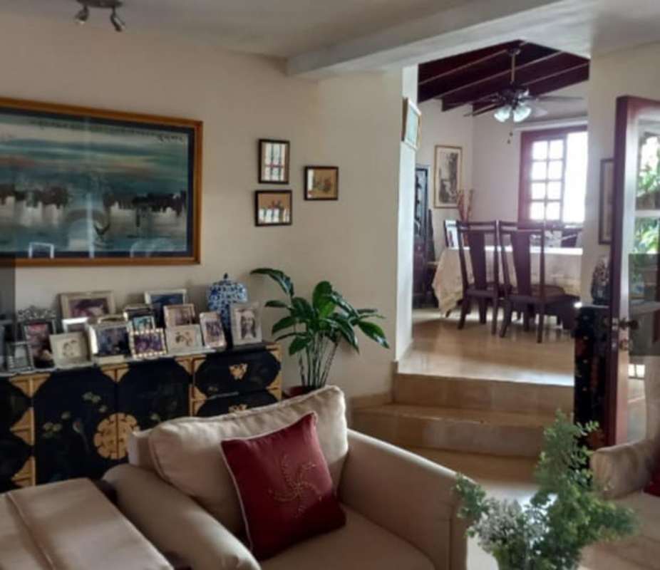 Traditional living and dining area with ceiling fan, art and seating San Miguelito Panama