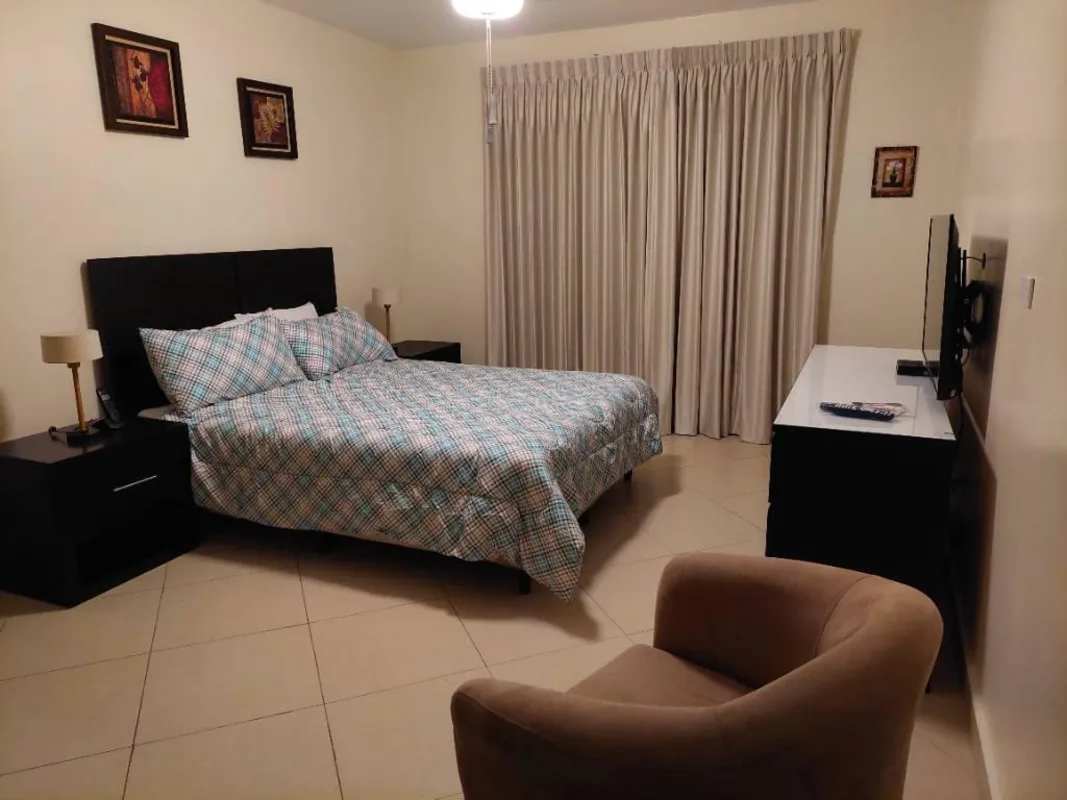 Bedroom with ensuite bathroom and window Embassy Club Clayton Panama rental