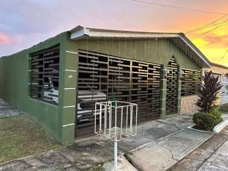 Kitchen with granite countertops, wood cabinets, stainless appliances in Praderas del Campo Panama