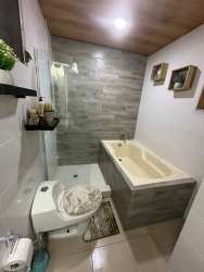 Spacious bedroom with PVC ceiling, LED lighting, tile floor at Praderas del Campo Panama