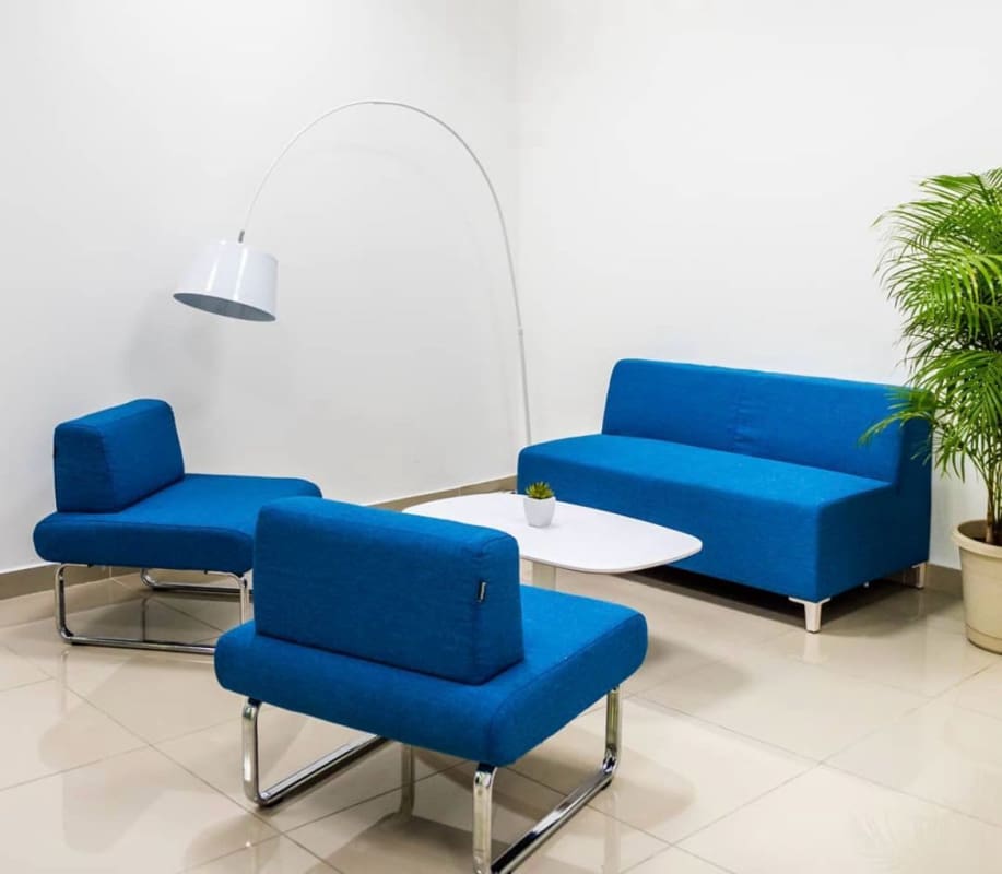 Blue sofa set, plants and modern design lobby area PH BICSA Financial Center Panama
