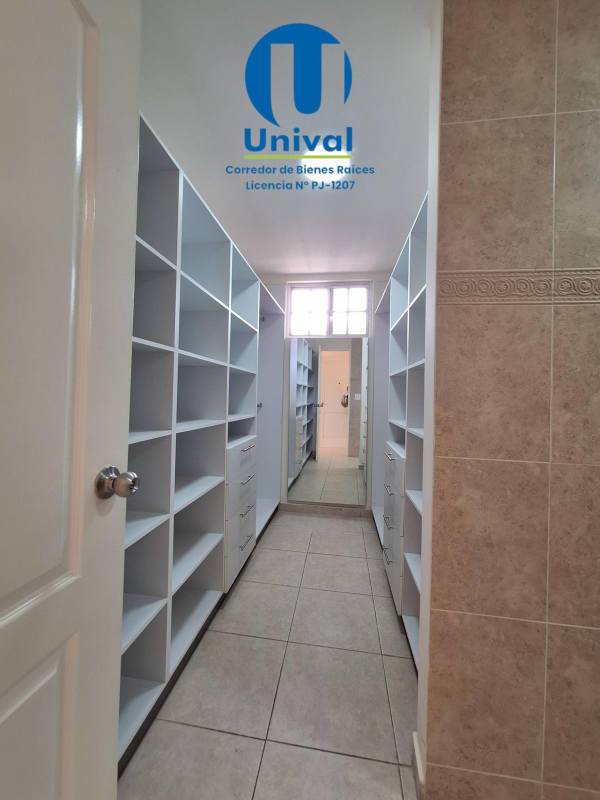 Spacious walk-in closet with shelves and drawers in master suite Albrook Gardens Panama
