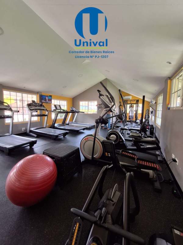 Indoor gym with treadmills, elliptical, large windows natural light Albrook Gardens Panama