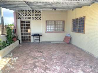 Covered patio with barbecue grill, tile flooring at Villa Zaita Panama