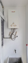 Laundry area with gas water heater and concrete sink in townhouse PH Residencias Las Lajas Arraiján