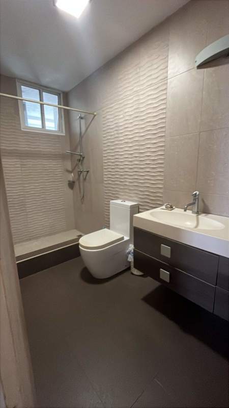 Bright secondary bedroom with built-in closet and urban view at PH Via Argentina Panama City