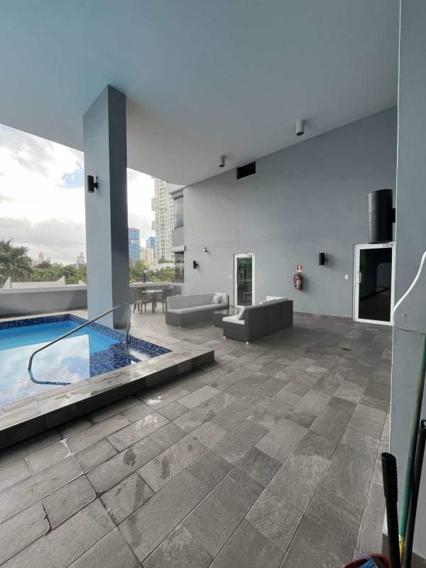 Outdoor swimming pool, sun deck and covered lounge area in PH Marbella Tower Panama City