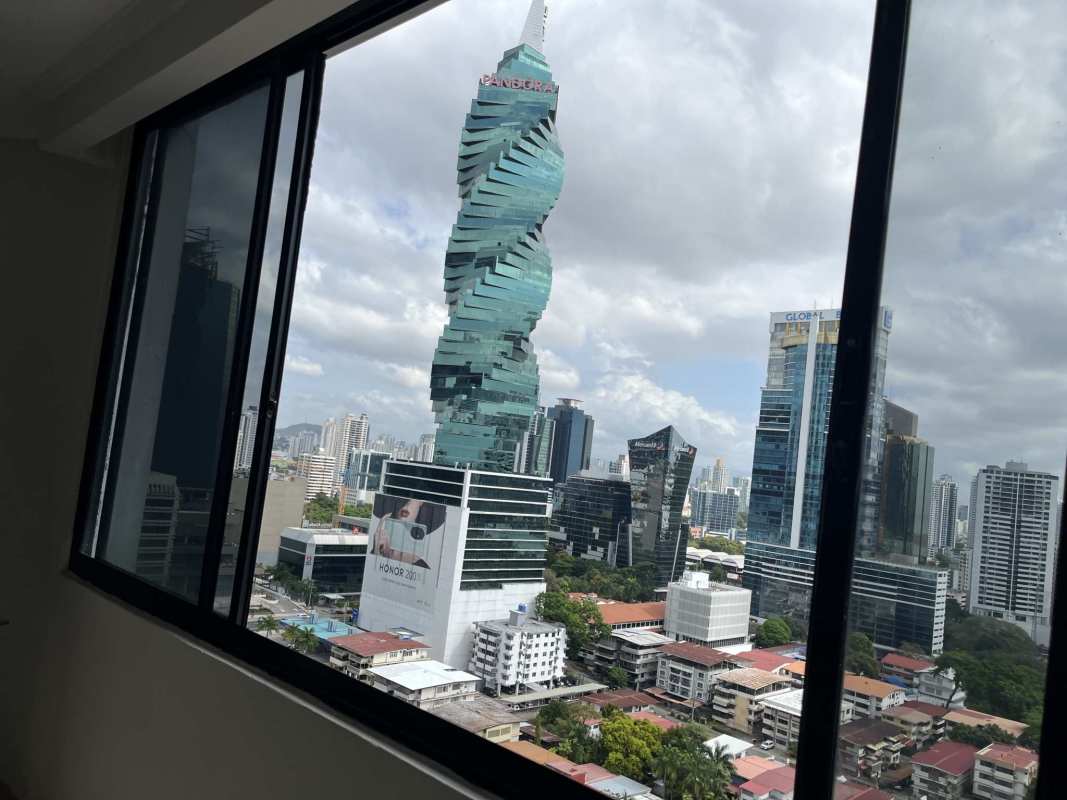 Bright living room with large windows, city view, tile flooring in PH Marbella Tower Panama City