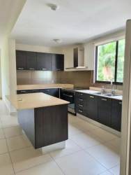 Bright living room with tile floors and balcony view, PH River Valley Panama Pacifico