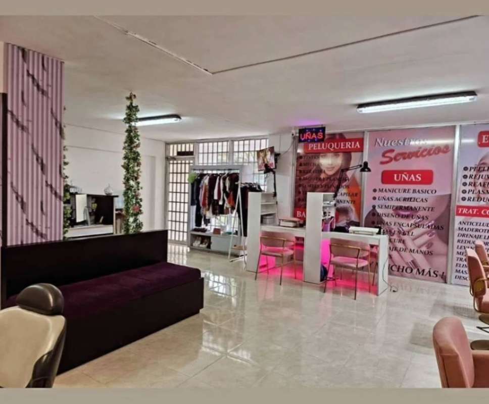 Salon with nail technician stations, striped accent wall, banners in El Carmen Vista Hermosa Panama