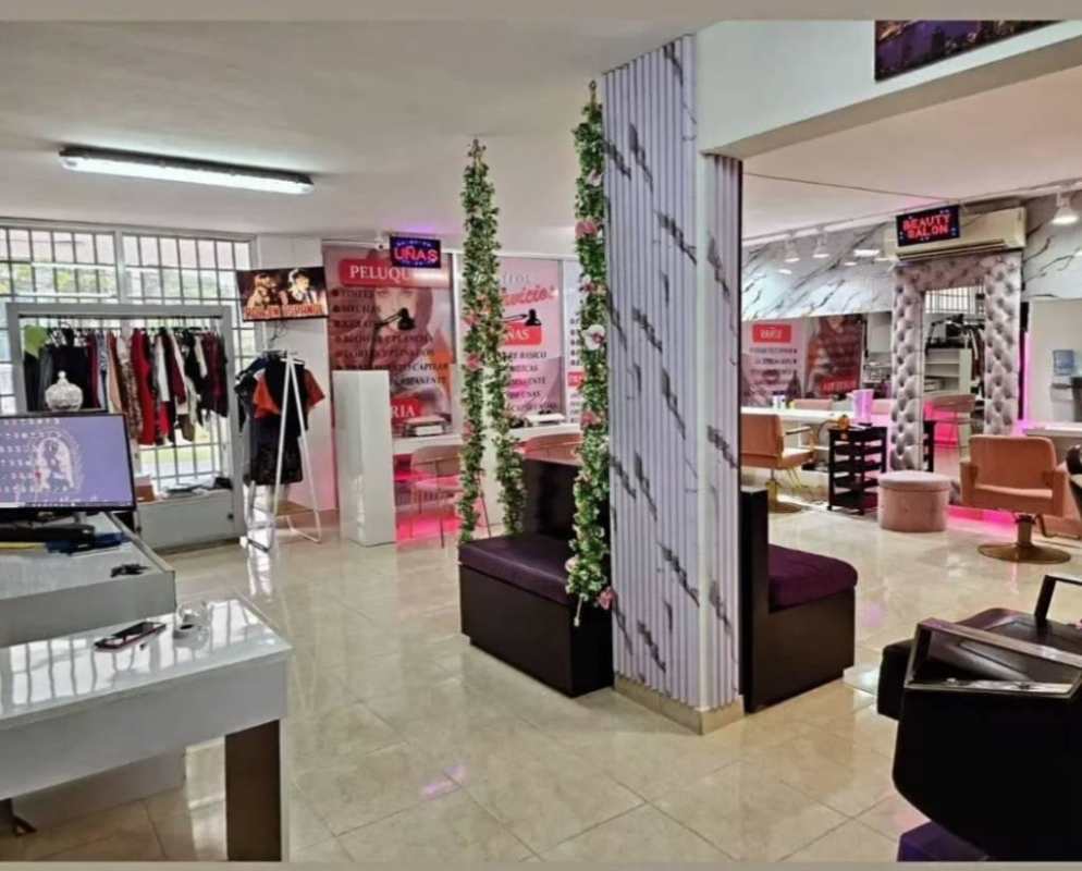 Interior of beauty and barber salon with marble accents, mirrors, stylish furniture in Bella Vista area Panama