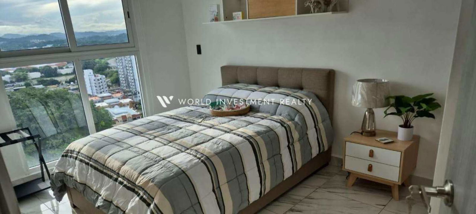 Secondary modern bathroom with marble-look tiles, glass shower at PH El Botánico Panama City