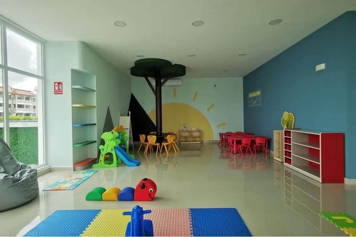 Indoor playroom with colorful decor and toys at PH El Botánico Panama City