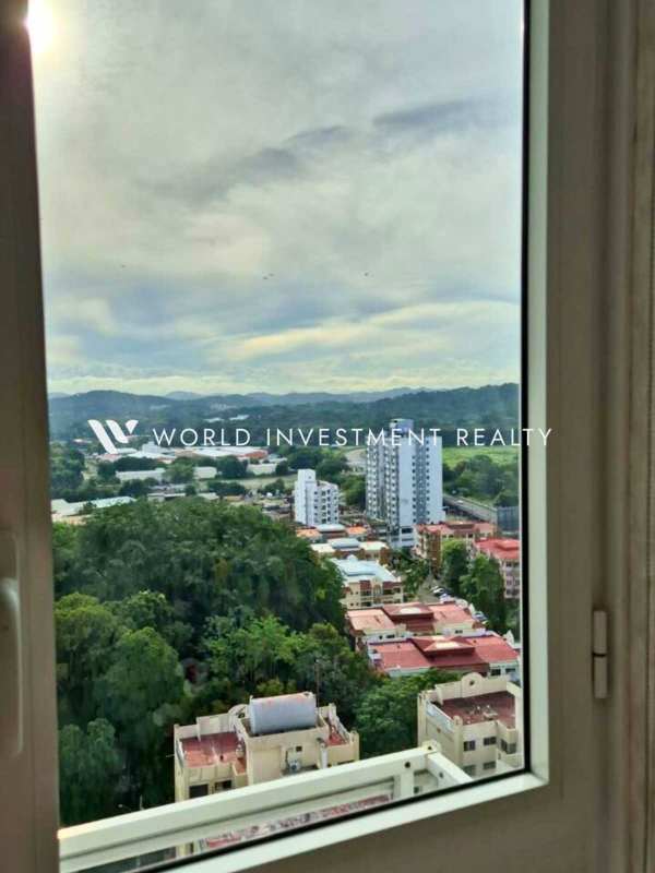 Bright bedroom with floor-to-ceiling windows overlooking city in PH El Botánico Avenida Balboa Panama City