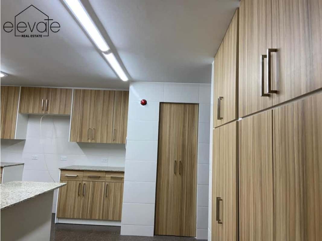 Bright open living and dining room with access to enclosed balcony bar and terrace PH Parque Mar Paitilla Panama City