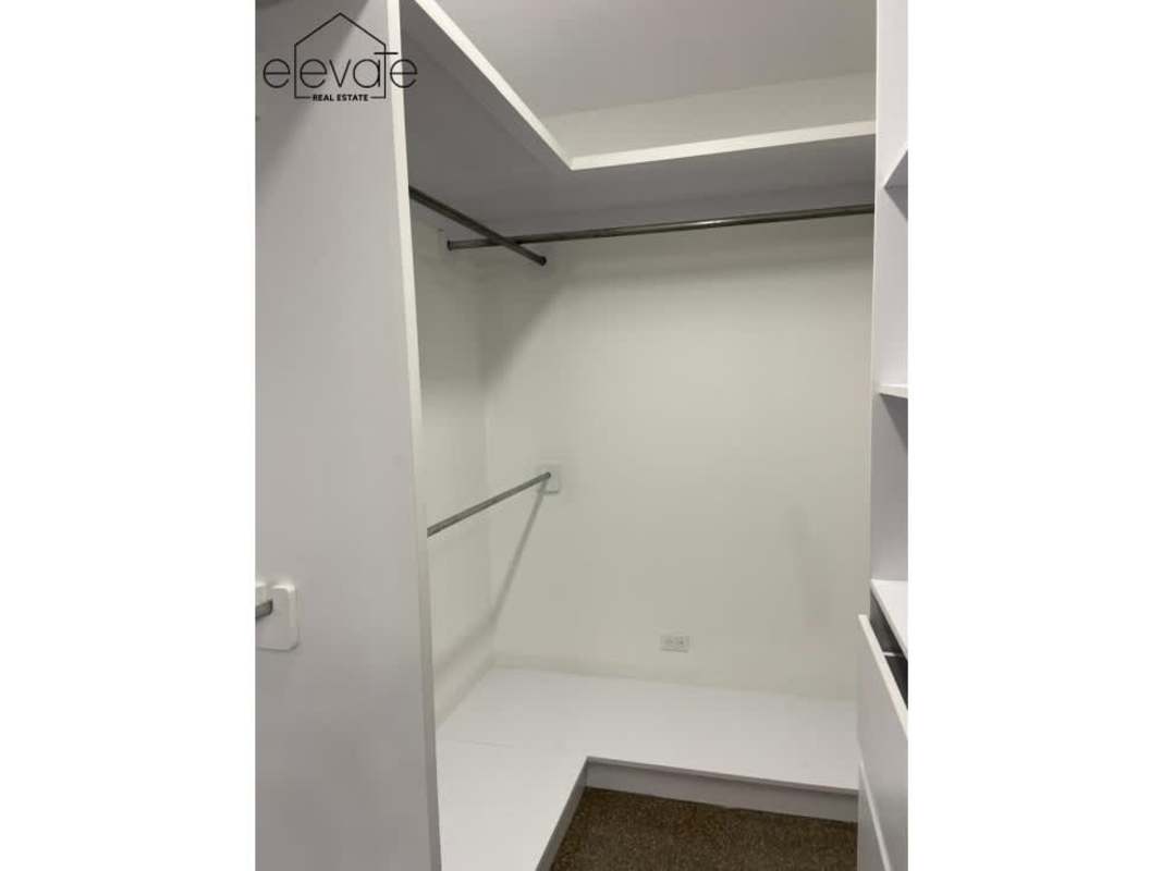 Large enclosed balcony with bar area opening onto private covered terrace in PH Parque Mar Punta Paitilla Panama