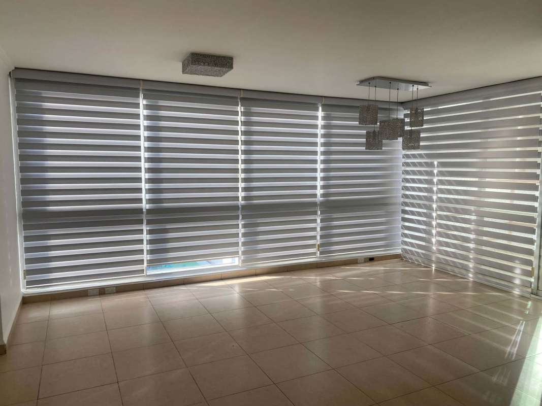 Bedroom with city view window, AC, and built-in closets at PH Riverside Costa del Este