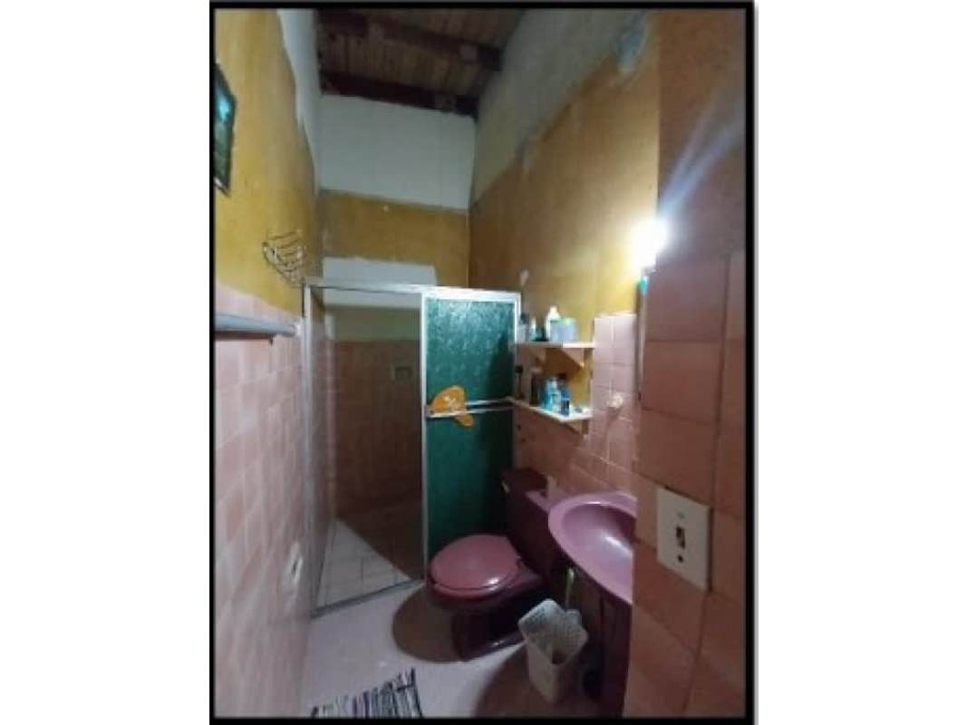 Rustic bathroom pink tiles wood beam ceiling glass shower Urbanización Anayansi Juan Díaz Panama