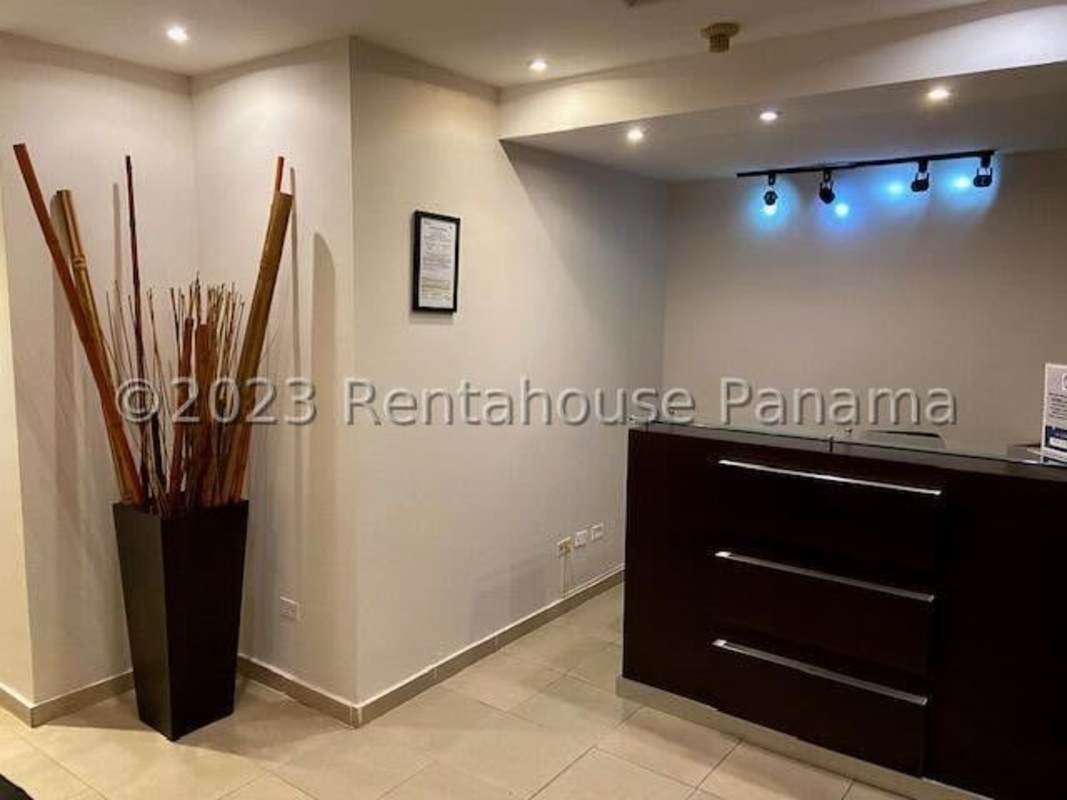 Modern commercial building facade with glass and signage in Bella Vista, Panama City.