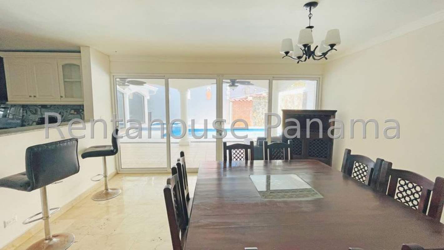 Contemporary kitchen with granite countertops and pendant lights in La Alameda Panama
