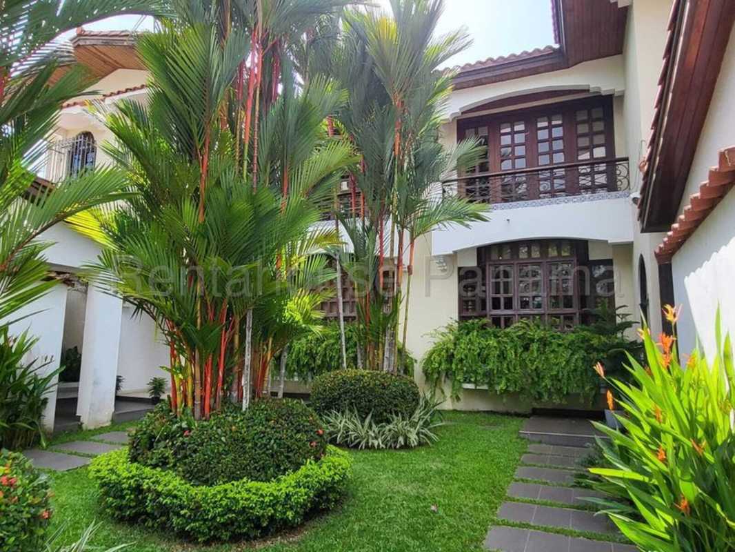 Front view of two-story Mediterranean house with garden balcony in El Carmen Panama
