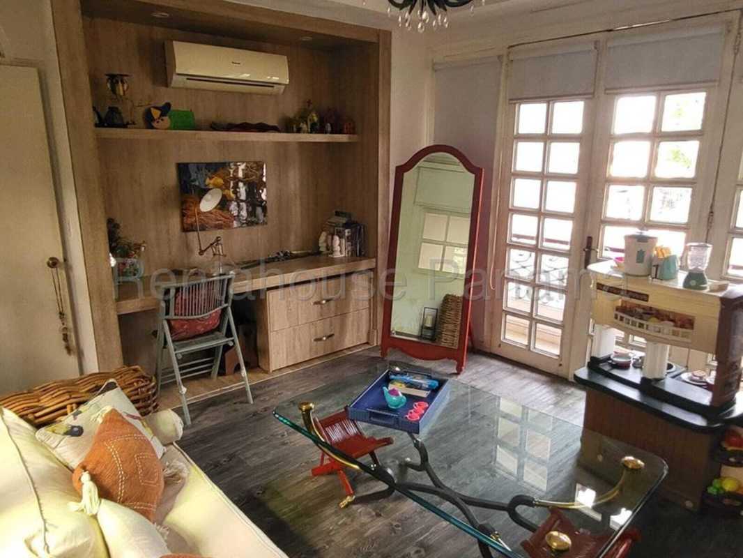 Spacious living room with granite flooring and dining area in Panama City house