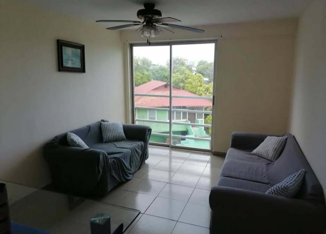 Living room with natural light, balcony view in Rio Abajo apartment for rent Panama