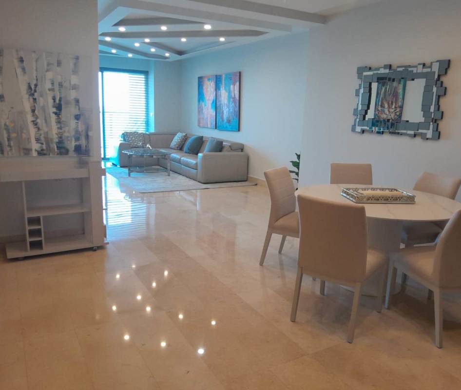 Modern kitchen with quartz countertops and appliances in Yoo Panama Apartment