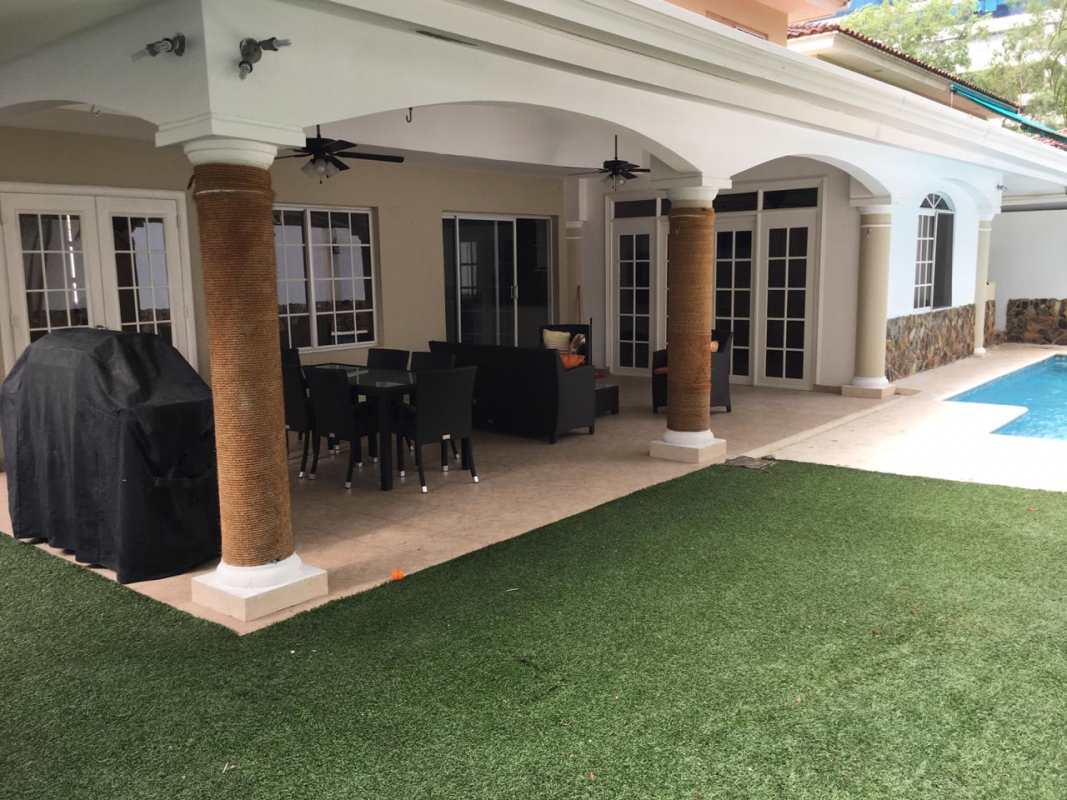 Bright living room with terrace access, ceiling fan, AC unit in Costa Azul Costa del Este Panama